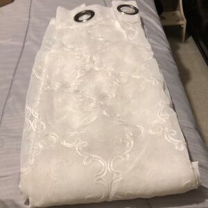 NEW without tags three curtains panels 36X84 each , off white.